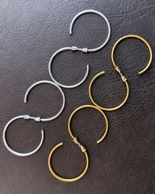 Refla streamline hoops on leather background
