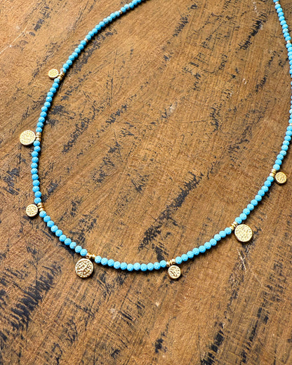 Ancient Coin Dance Necklace – turquoise-hued beaded necklace with hammered gold coin charms by Refla