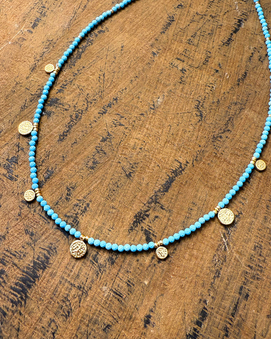 Ancient Coin Dance Necklace – turquoise-hued beaded necklace with hammered gold coin charms by Refla