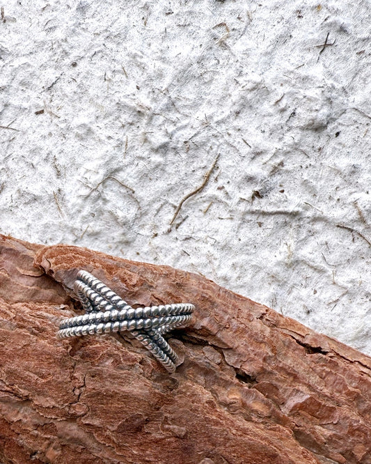 Textured crisscross silver ring with artisan feel