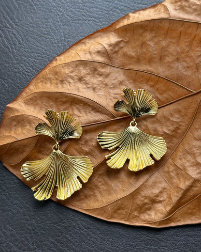 Botanical style statement earrings with fan-shaped leaves