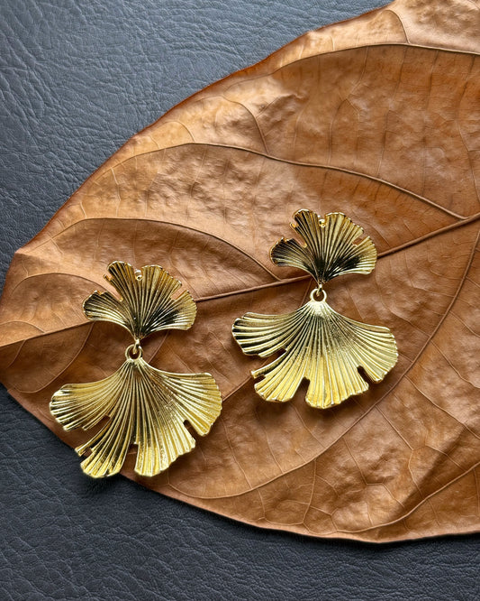 Botanical style statement earrings with fan-shaped leaves