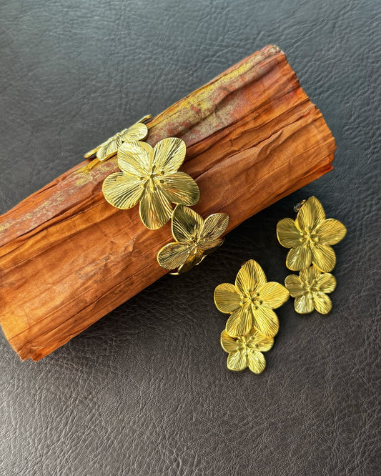 gold cherry blossom earrings and bracelet